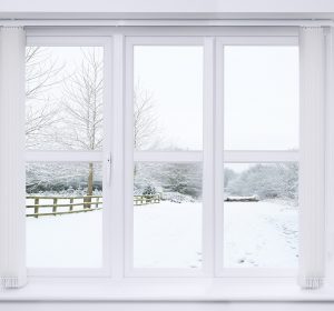 Modern window with snow scene outside