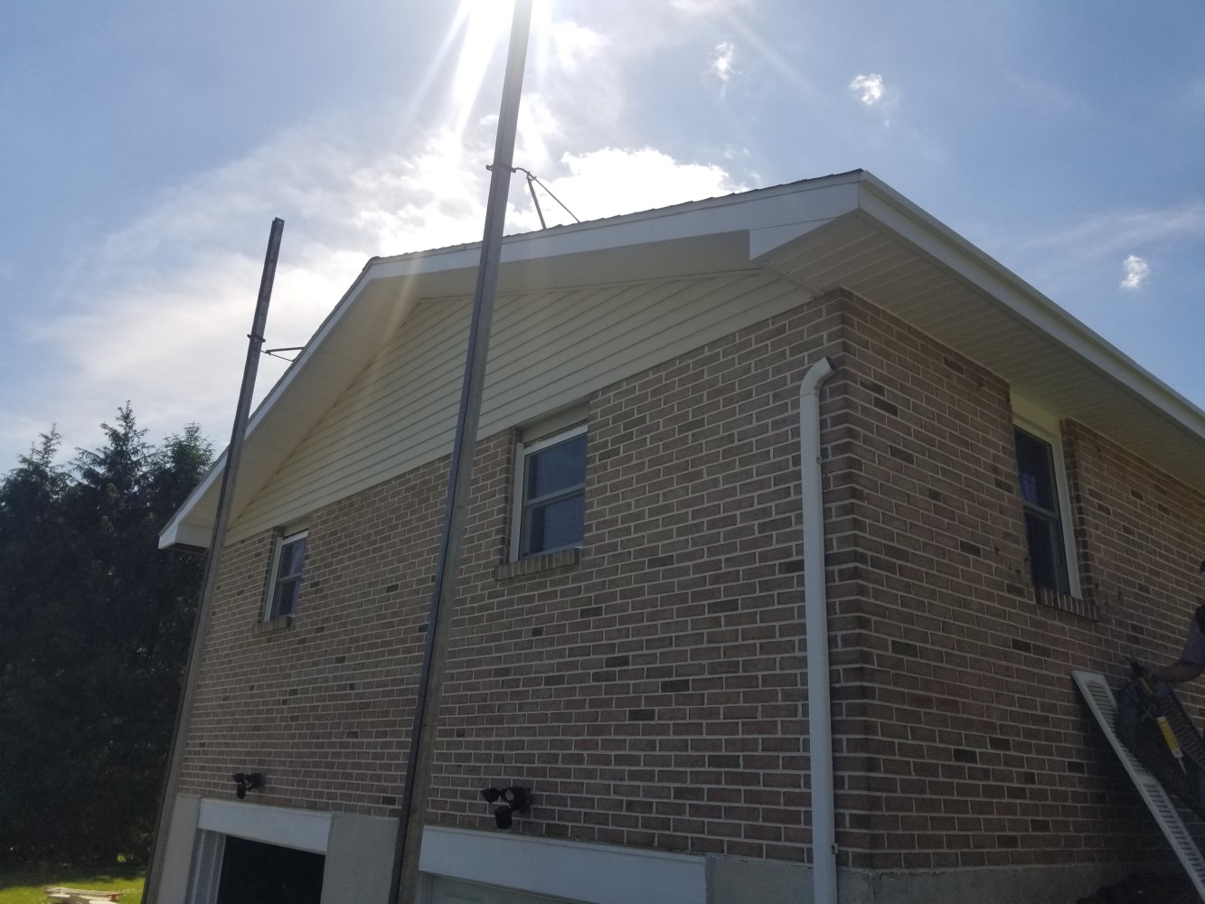 angled view of new simple windows installed in a brick house