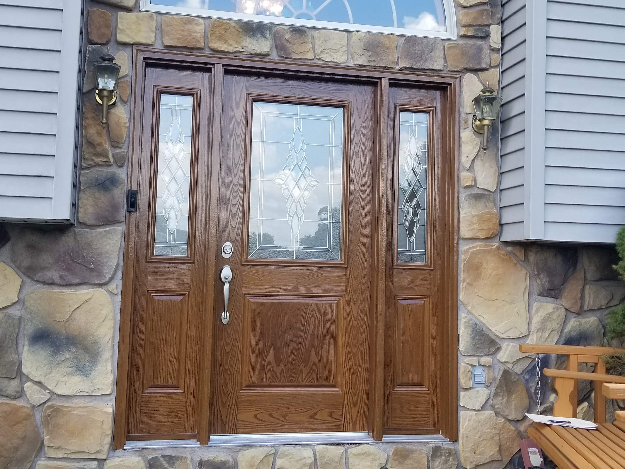 beautiful wood front door with diamond glass accents