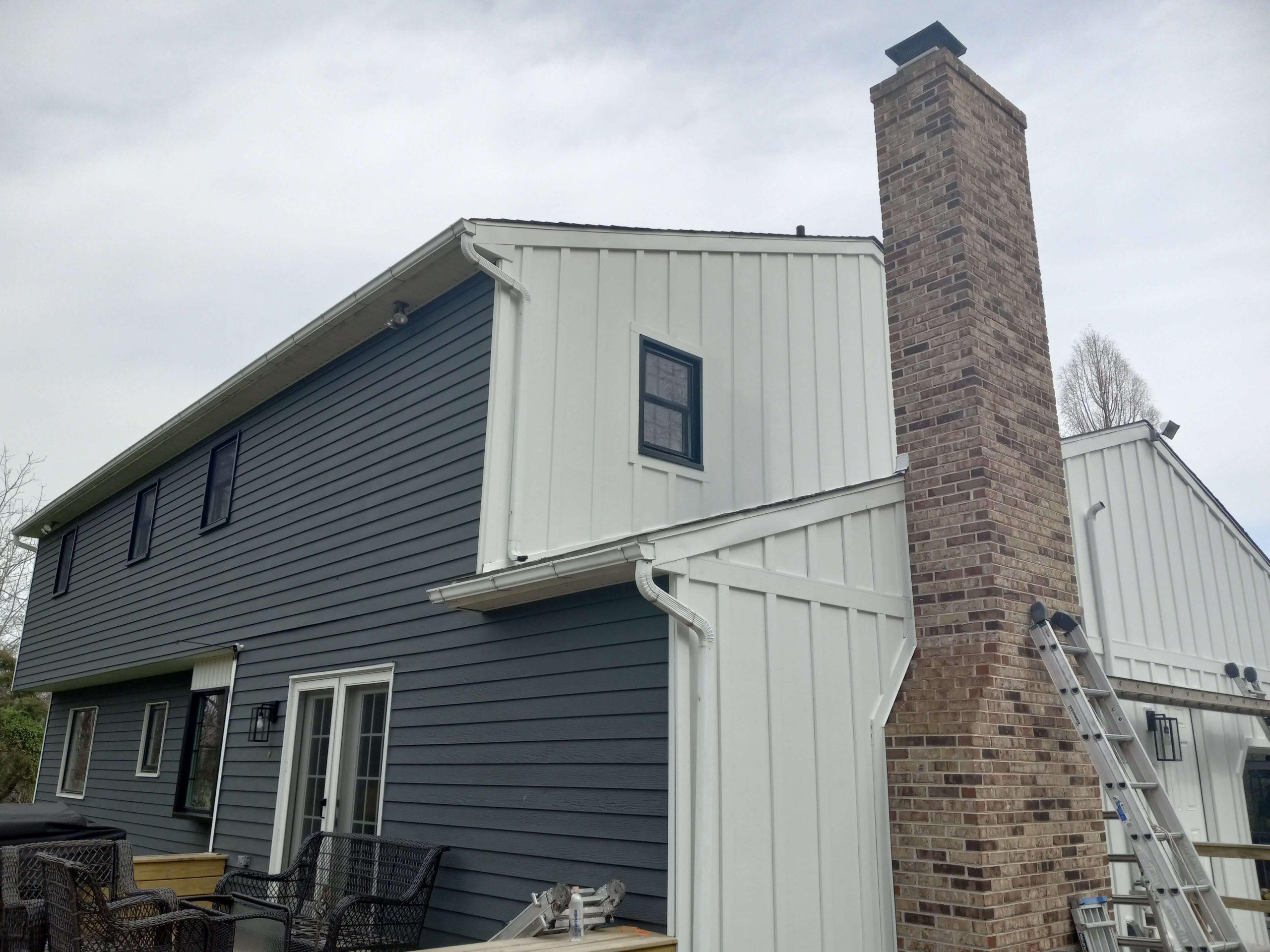 home with white and blue siding with new openable windows on both floors, tall windows with square panels