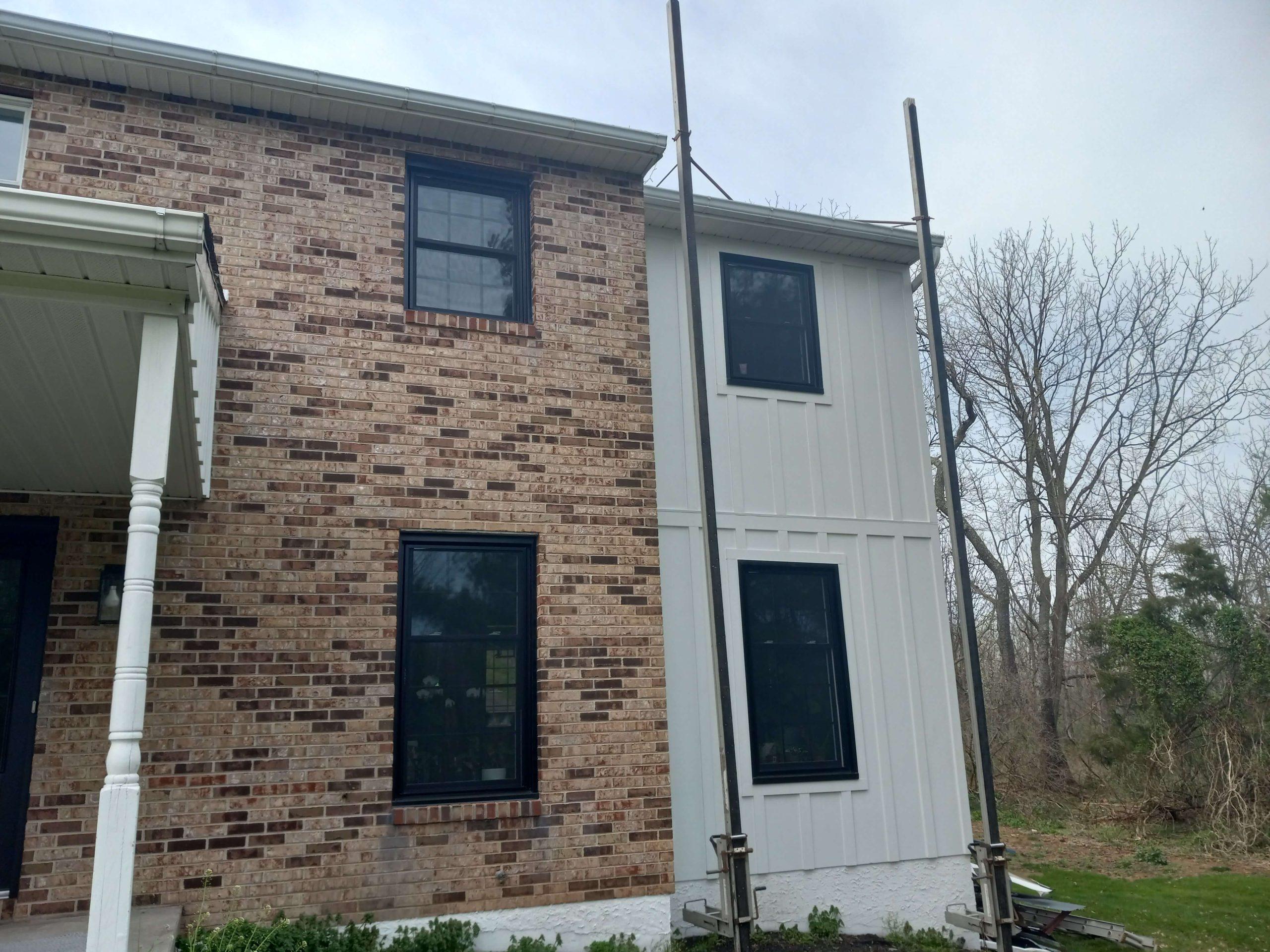 new windows in brick and siding parts of home, tall windows with square panels