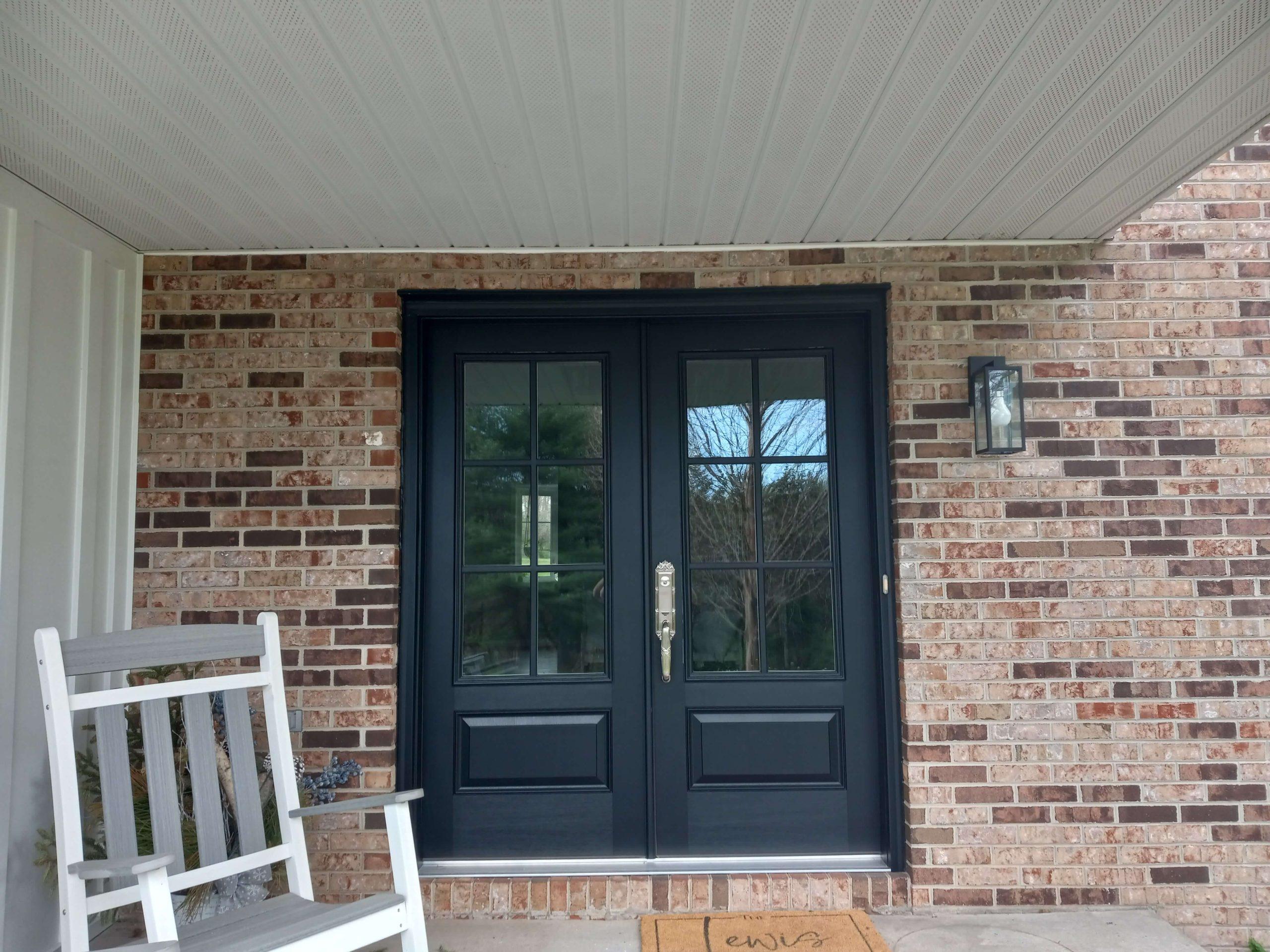 new double front doors with large windows and a deep blue almost black color