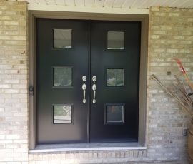 black double doors in front entrance with modern triple window layout